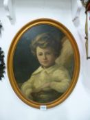 A gilt framed oval oil on canvas portrait of a child