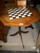 An inlaid ivory and rosewood chess top table