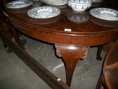 An oval mahogany table