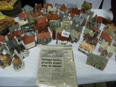 A large collection of model cottages