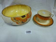 A Clarice Cliff bowl, a/f and a Clarice Cliff cup and saucer