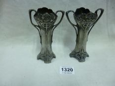 A pair of Art Nouveau pewter vases