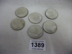 6 White metal coins