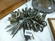 A large quantity of vintage bottle openers