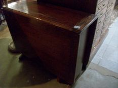 An oak drop leaf table