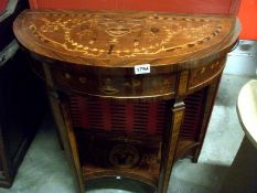 A marquetry inlaid D shaped console table