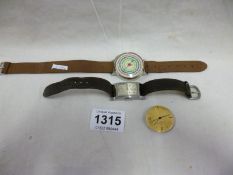 A Tissot Art Deco oblong watch, an Eterna-matic watch movement and a watch/map distancer