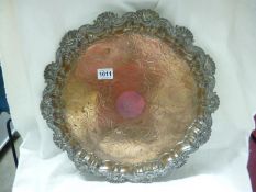 An Ornate silver plate on copper footed tray (would benefit from re-plating) 46cm diameter