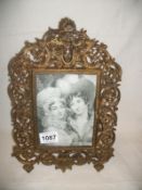 A Victorian brass photo frame