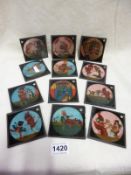 A set of 12 Punch and Judy coloured magic lantern slides