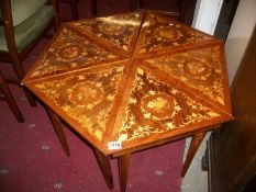 An inlaid hexagonal nest of 6 musical tables all playing different tunes