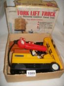 A boxed Palitoy battery operated fork lift truck (box distressed)