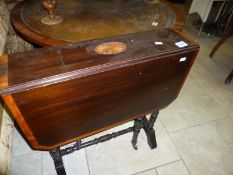 A mahogany Sutherland table with shell inlay