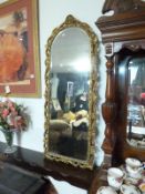 A gilt framed arch top mirror