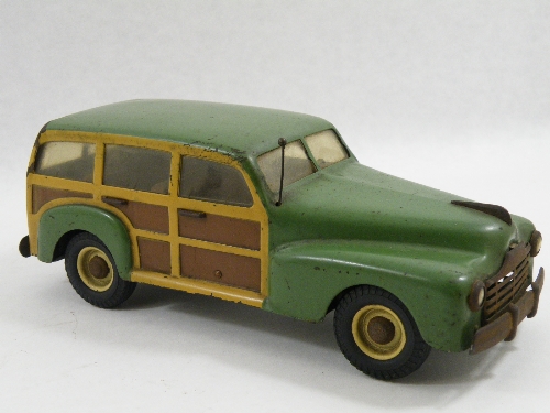 Italian tinplate toy: MLB Marchesini. Brevettato American Woody station wagon. Boot lifts to