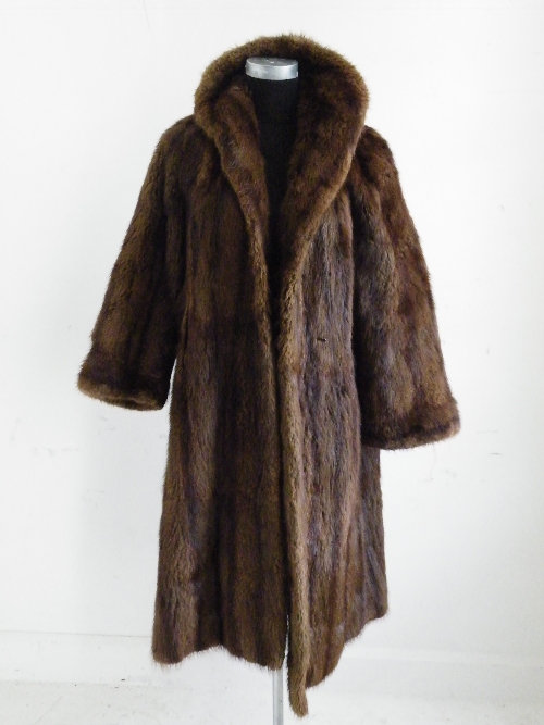 A ladies full length brown fur coat with Faulkes, Edgebaston Birmingham label