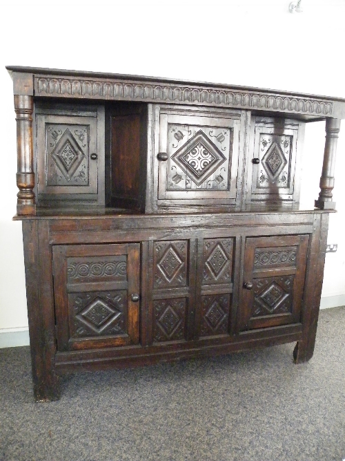 A heavily carved Oak Court Cupboard constructed from period 17th, 18th century and later timbers..