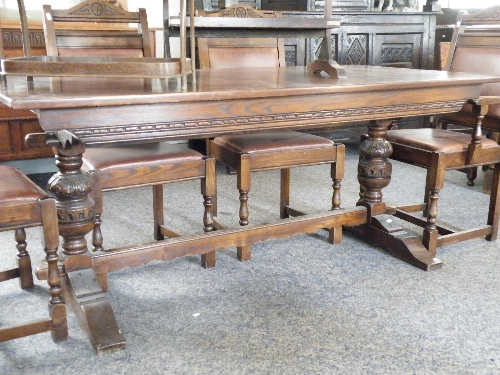 A quality dark oak refectory table with peg detail, carved bulbous legs & under stretcher. The top