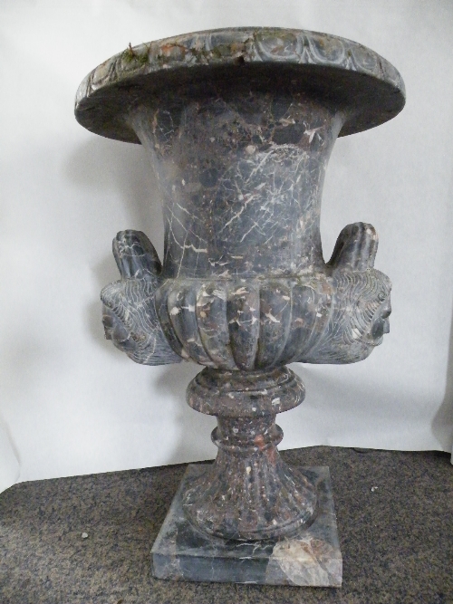 A black solid conglomerate marble Campana pedestal urn with weathered finish and small losses - with