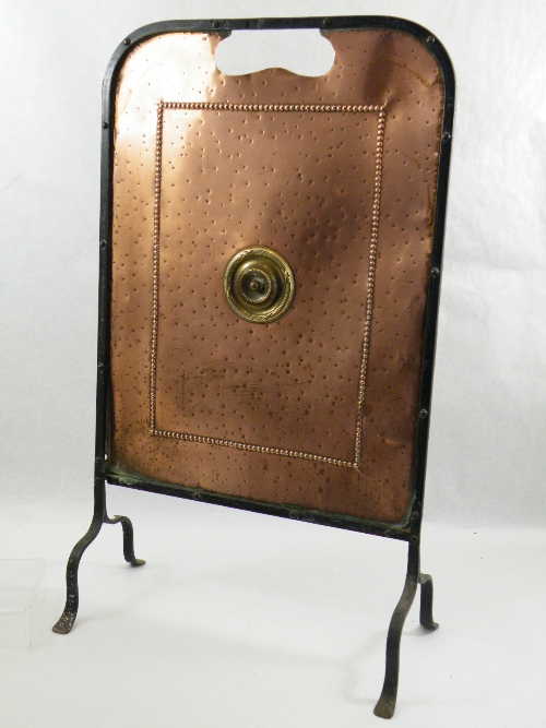 Edwardian Arts & Crafts style Wrought iron fire screen with copper centre panel and raised brass