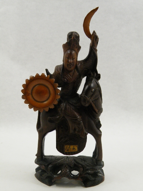 Interesting Japanese carved hardwood figure of a warrior on horseback with boxwood shield and