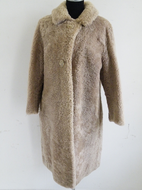 A ladies full length astrakhan fur coat.