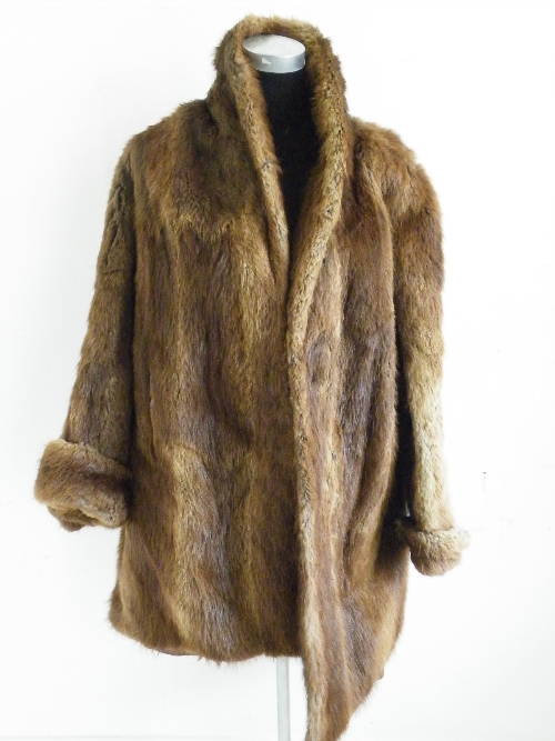 A ladies full length brown fur coat