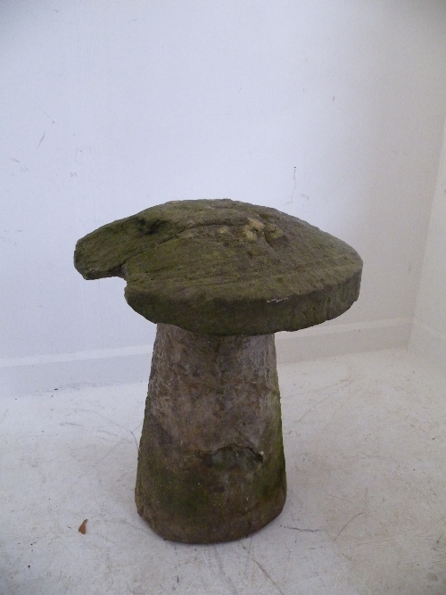 A sandstone garden staddle stone 68cm high x 52cm diameter