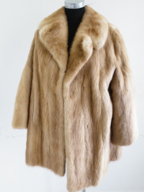 A ladies full length pale brown mink coat.