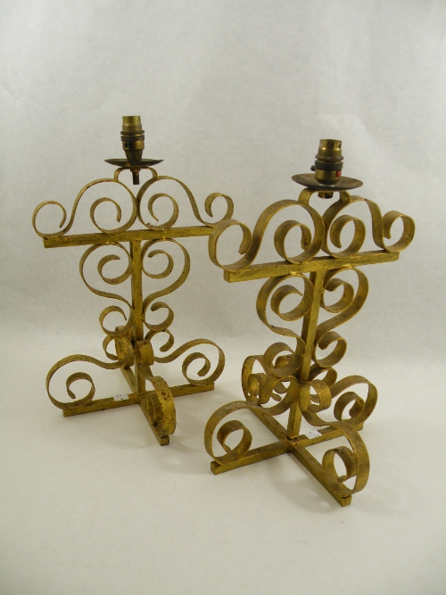 A pair of gilt wrought metal table lamps 44cm high