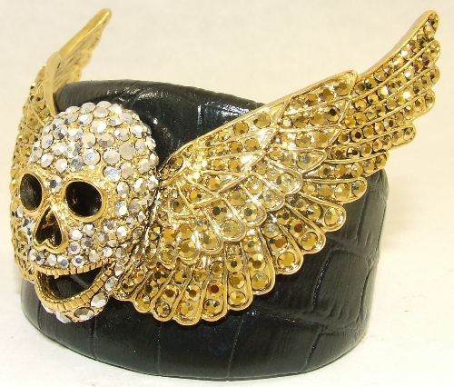 Butler & Wilson leather cuff bangle with central rhinestone set winged skull