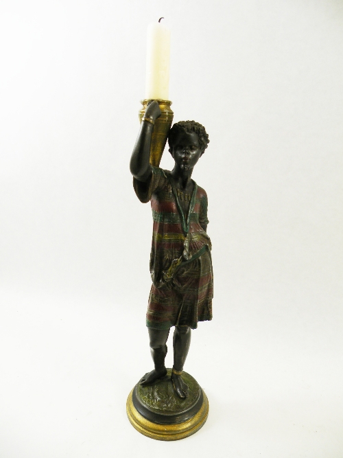 A late 19th C bronzed spelter candelabra figure of a Nubian / Blackamoor slave holding a water