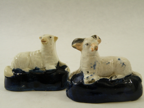 Early 19th Century Staffordshire Pottery figures of a recumbent sheep and ram, on oval base with