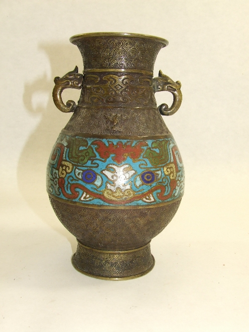 Oriental/ Chinese bronze vase with dragon mask handles and champ levee enamel band 21.5cm tall