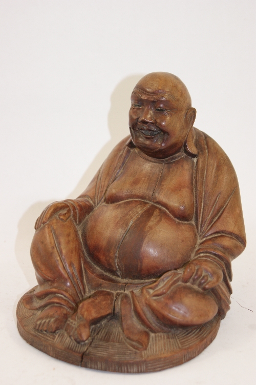 Oriental carved hardwood figure of Buddha 17cm H