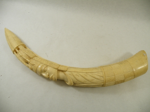 An impressive late 19th Century ivory tusk - carved with African tribal motifs and relief carved