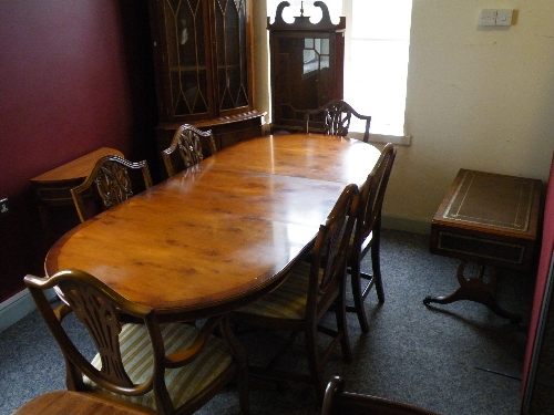 A reproduction yew wood and finish dining suite comprising: twin pedestal table with single leaf,