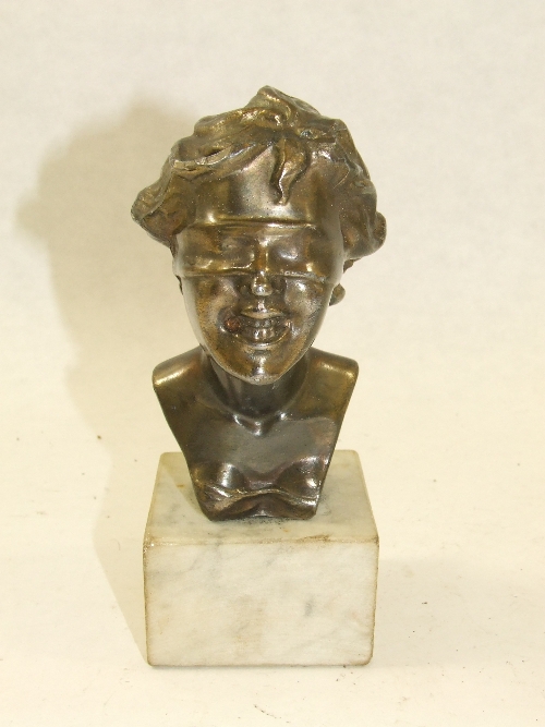 A late 19th C spelter Art Nouveau blindfolded laughing woman after Giuseppe Renda, on a square