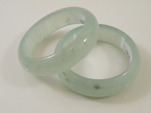 Two Chinese Celadon jade bangles 7.5cm diameter