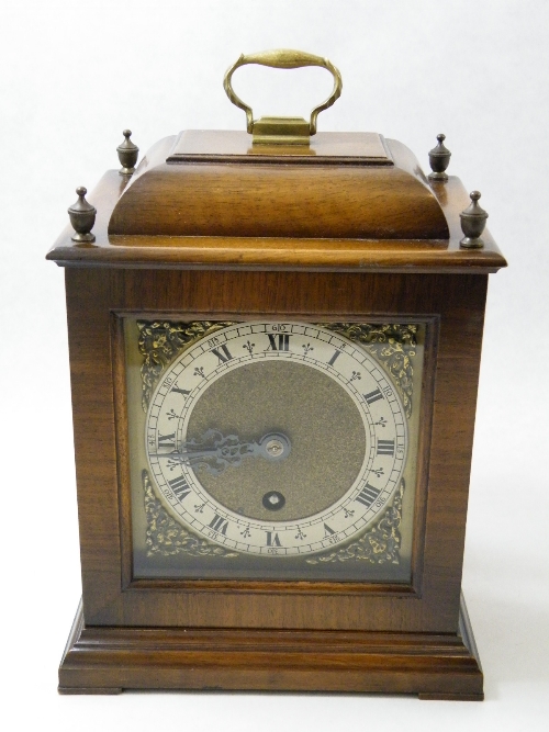 Walnut cased mantle clock with 4 urn shaped finials, brass dial 26cm x 18cm