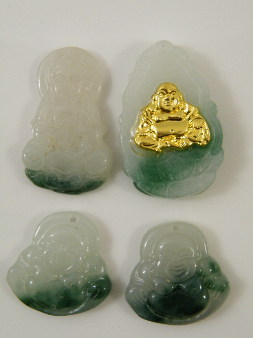 Four Chinese jade/jadeite carved pendants biggest 4cm high.