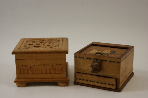 A Swiss carved linden wood musical box with carved Arabesque scroll to top 11cm sq and an Art Deco