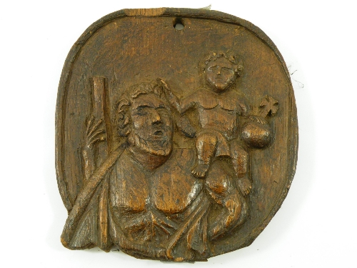 A 19th century carved plaque of St Christopher carrying the infant Jesus - possibly Welsh - 19cm x