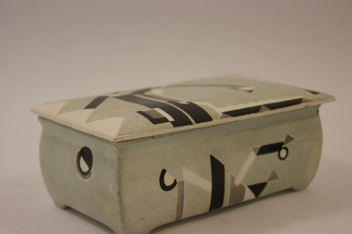 A French Art Deco Modernist covered ceramic cigarette box painted in monochrome and silver  stylized