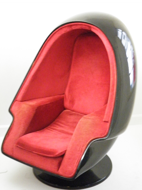 Retro: A black fibreglass Alpha Stereo egg chair  with integrated speakers and cable jack.  The