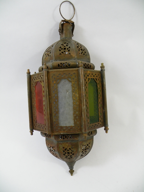 A Moorish octagonal lantern with alternating panels of coloured and opaque glass 36cm high