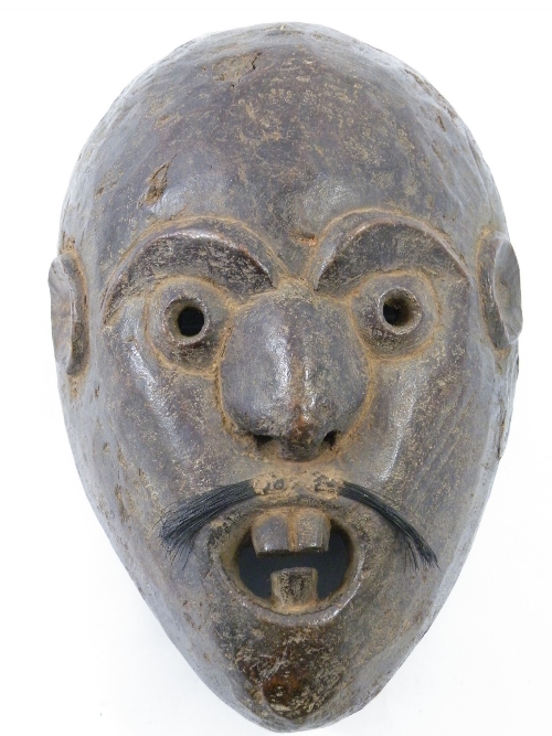 Tribal: An unusual carved wooden Shaman face mask - possibly Himalayan -the grotesque mask with