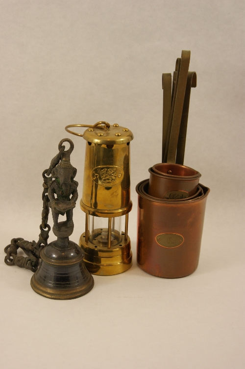 A mixed lot of interesting items to include: Indian censer bell, brass miners lamp with the Welsh