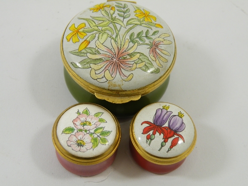 Three Crummels pill boxes each with floral decoration to the lid