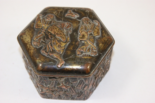 An Oriental, possibly Japanese, mixed metal hexagonal box, with brass and copper highlights, the